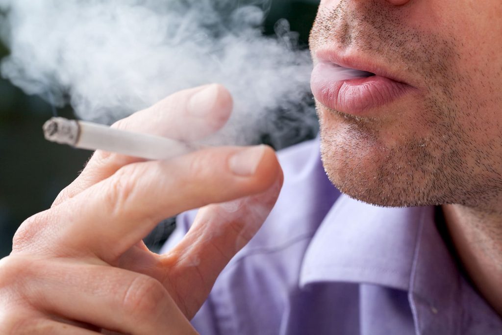 Closeup of man smoking cigarette