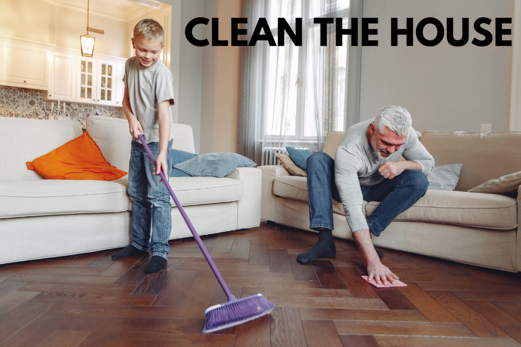 Dad and son cleaning floors in living room