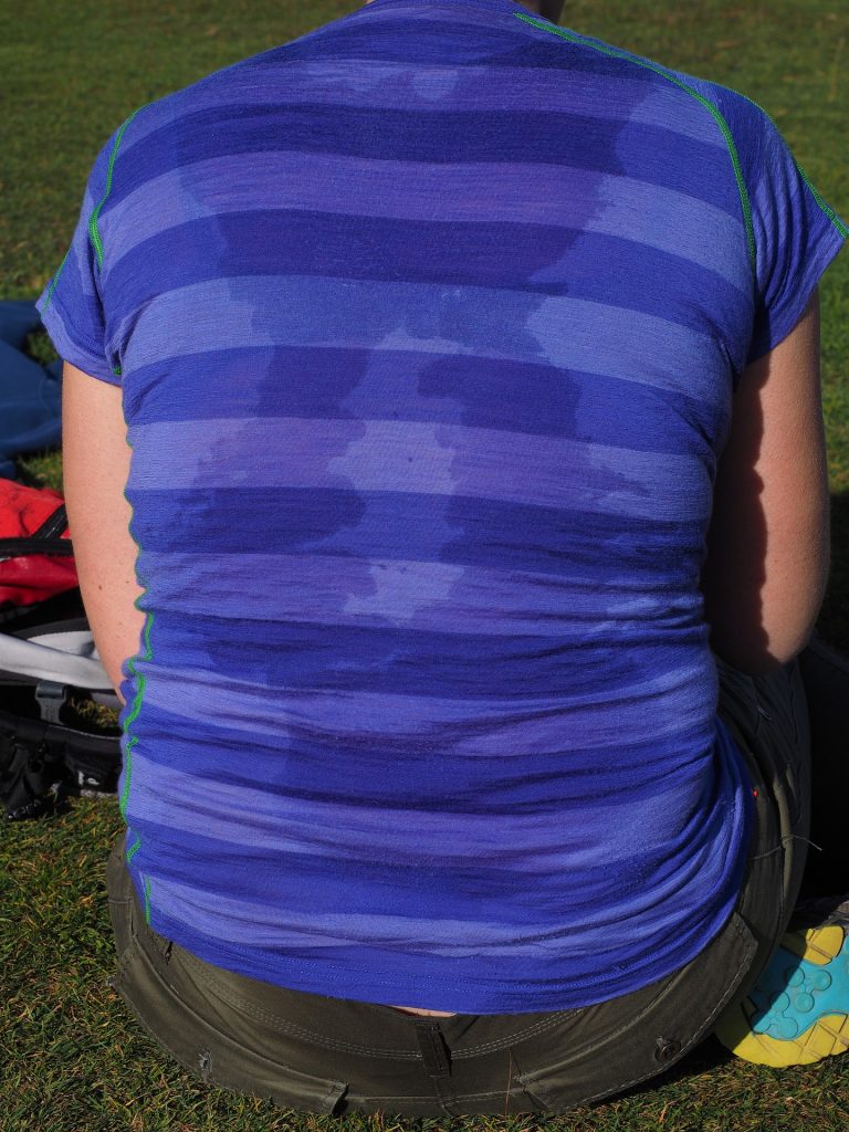 sweat back of person wearing blue shirt