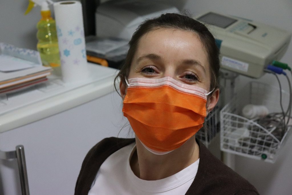 Nurse wearing orange mask